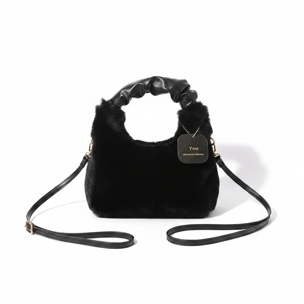Black faux fur shoulder bag flat lay on white background