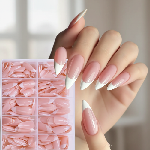 Woman's hand with almond French tip press-on nails applied